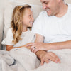 Child sharing a warm moment with Dad, wrapped in a super soft Boucle blanket - Saranoni