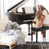 Plush Boucle blanket making the piano room feel warm and inviting. - Saranoni