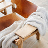 Soft and cuddly Boucle blanket draped over a kitchen chair - Saranoni