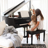 Gray Boucle blanket providing coziness in an elegant piano room- Saranoni