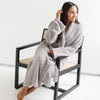 Woman smiling, wrapped in beautiful Gray COZY BAMBONI ROBES - Saranoni