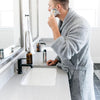 Man in bathroom, shaving beard, dressed in Gray COZY BAMBONI ROBES - Saranoni