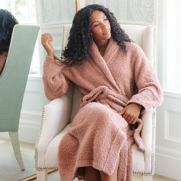 Woman sitting on chair in her Beautiful French Rose COZY BAMBONI® ROBES - Saranoni