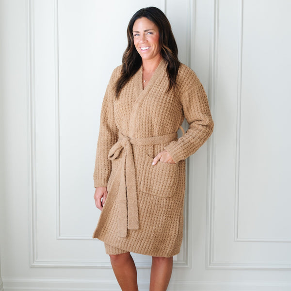 Woman standing in cozy, tan Waffle Knit robe. 