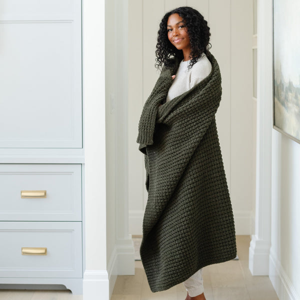 Wrapped up in a soft, warm, green XL waffle knit blanket. 