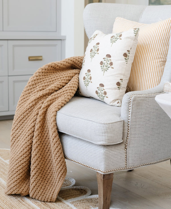 XL tan waffle knit blanket draped across chair.