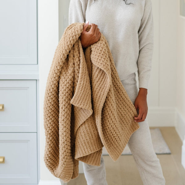 Detailed view of an extra large waffle knit blanket.