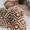 Mom soothing baby wrapped in beautiful Khmer DOUBLE-LAYER BAMBONI MINI BLANKETS - Saranoni