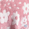 A double-layer Bamboni® baby blanket. The plush, breathable blanket features a two-tone light pink and pink floral design, offering ultimate softness and warmth. Made from Saranoni’s signature stretchy, cloud-like Bamboni® fabric, this luxury baby blanket provides comfort for naps, tummy time, and on-the-go snuggles. The soft blanket is a receiving blanket and Saranoni blanket. 