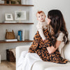 Mom and little girl snuggling in Classic Leopard DOUBLE-LAYER BAMBONI® RECEIVING BLANKETS - Saranoni