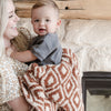 Mom and little boy smiling with adorable, cozy Khmer DOUBLE-LAYER BAMBONI RECEIVING BLANKETS - Saranoni