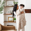 Mom and young girl snuggling up with beautiful Tan Leopard DOUBLE-LAYER BAMBONI® RECEIVING BLANKETS - Saranoni