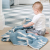 Little boy playing with his super soft and extra stretchy Blue Triangle DOUBLE-LAYER BAMBONI RECEIVING BLANKETS - Saranoni