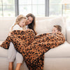 Mom snuggled up with kids on couch in beautiful Classic Leopard DOUBLE-LAYER BAMBONI THROW BLANKETS - Saranoni