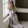 Little girl sitting in the window sill with a beautiful Gray Leopard DOUBLE-LAYER BAMBONI® TODDLER BLANKETS - Saranoni