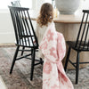 Little girl bringing her beautiful blanket to the table with her - Pink Petal DOUBLE-LAYER BAMBONI TODDLER BLANKETS - Saranoni