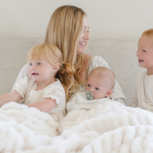 DOUBLE RUCHED FAUX FUR THROW BLANKETS - Saranoni luxury blankets with ruched detail, perfect for snuggling