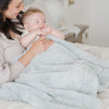 Mom playing with baby in heather blue DREAM MINI BLANKETS - Saranoni