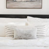 Saranoni Grand pillow cover in a modern living space with luxury blankets