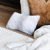 Luxurious Saranoni knit pillow cover featured in a cozy and elegant living space