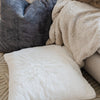 Saranoni Grand Pillow Cover in a Reading Nook - Adds a touch of luxury to your favorite reading space.