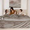 Oversized Saranoni blanket providing full queen bed coverage.