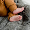 Luxuriously soft Saranoni blanket, ideal for snuggling with your infant.