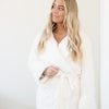 GRAND FAUX FUR ROBES - Woman wrapped up in a comfy Saranoni robe.