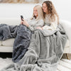 GRAND FAUX FUR SLEEPING BAGS - Close-up of the plush gray mink fabric, highlighting the luxurious texture.