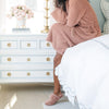 Luxury bedroom with Saranoni faux fur slippers and bamboni robe.