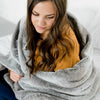 Grand Saranoni throw blanket providing luxurious comfort and style.