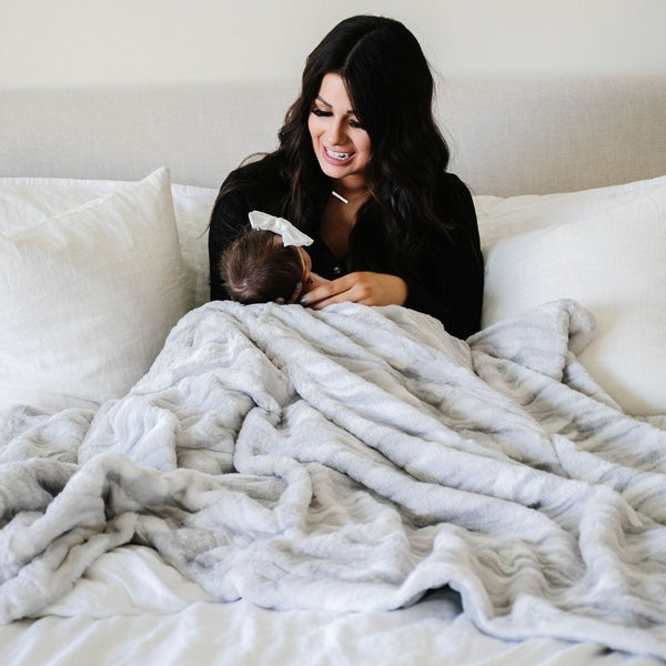 MARBLE FAUX FUR/MINKY XL THROW BLANKETS - Beautifully patterned Saranoni Marble Faux Fur/Minky XL throw spread across a bed.