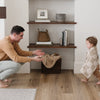 Dad and child playing with checkered MINKY STRETCH RECEIVING BLANKETS - Saranoni