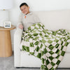 Boy snuggling with blanket on couch - MINKY STRETCH THROW BLANKETS - Saranoni