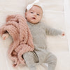 Little baby girl with beautiful light pink Cameo RIBBED BAMBONI MINI BLANKETS - Saranoni