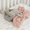 Baby girl in crib with soft and breathable light pink Cameo RIBBED BAMBONI MINI BLANKETS - Saranoni