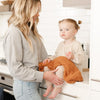 Mom and young girl in kitchen with Orange Ginger RIBBED BAMBONI MINI BLANKETS - Saranoni