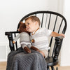 Young boy on rocking chair, sitting with adorable Charcoal RIBBED BAMBONI MINI BLANKETS - Saranoni