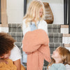 Cute little girls playing with super soft Peach/Pink Sunkissed RIBBED BAMBONI RECEIVING BLANKETS - Saranoni