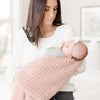 Mom holding baby in beautiful, soft and cozy light pink Cameo RIBBED BAMBONI RECEIVING BLANKETS - Saranoni