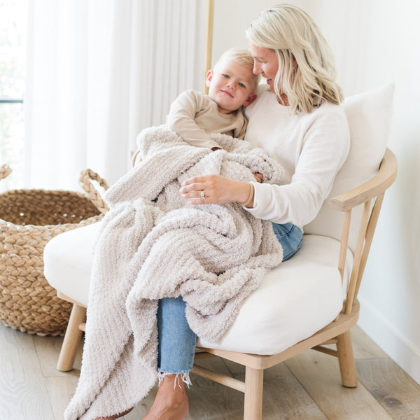 Mom and little boy snuggling together in extra cozy and warm Light Gray Moonbeam RIBBED BAMBONI TODDLER BLANKETS - Saranoni