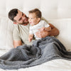 Dad and son wrapped together in beautiful, extra soft Charcoal RIBBED BAMBONI TODDLER BLANKETS - Saranoni