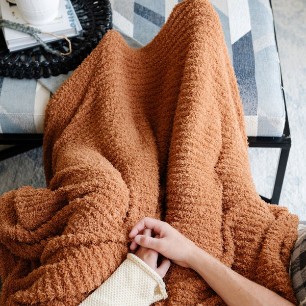 Family laying with extra cozy and soft burnt orange Ginger RIBBED BAMBONI XL BLANKETS - Saranoni