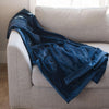 A Luxury Extra Large Oversized Throw Navy Colored Lush Saranoni Blanket. The soft blanket is an extra large throw blanket and has a soft faux fur feeling.