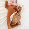 Gentle receiving blanket with a soft, plush feel, designed to keep your little one snug.