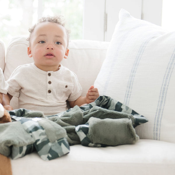 Snuggly mini blanket featuring a rich, soft texture with a luxurious satin back for added comfort and style.