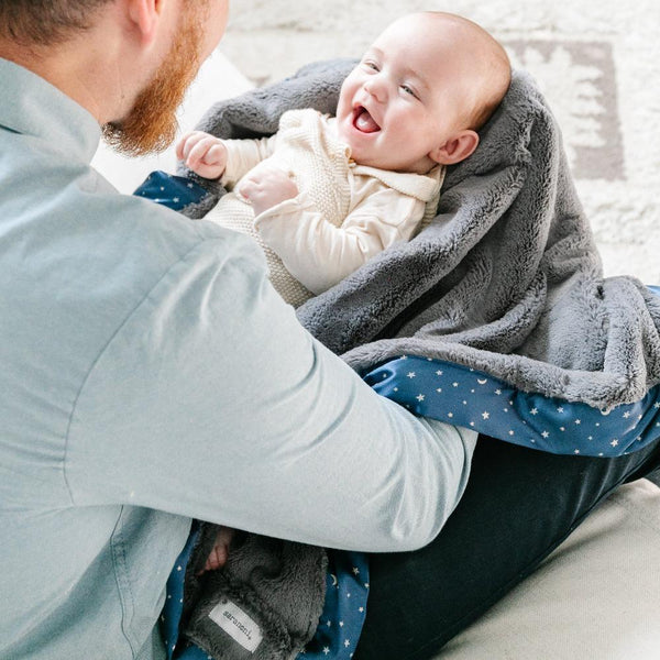 Plush receiving blanket featuring a silky satin back, perfect for keeping your baby warm and comfortable.