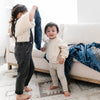 Plush receiving blanket featuring a silky satin back, perfect for keeping your children warm and comfortable.