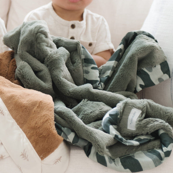 Comfortable receiving blanket with a satin back, perfect for a soothing, gentle wrap with a touch of elegance.