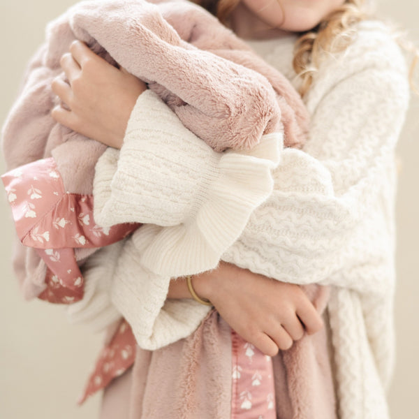 Warm and snuggly receiving blanket with a satin back, combining softness with a sleek, smooth finish.